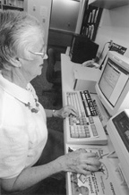 Volunteer working at a terminal.